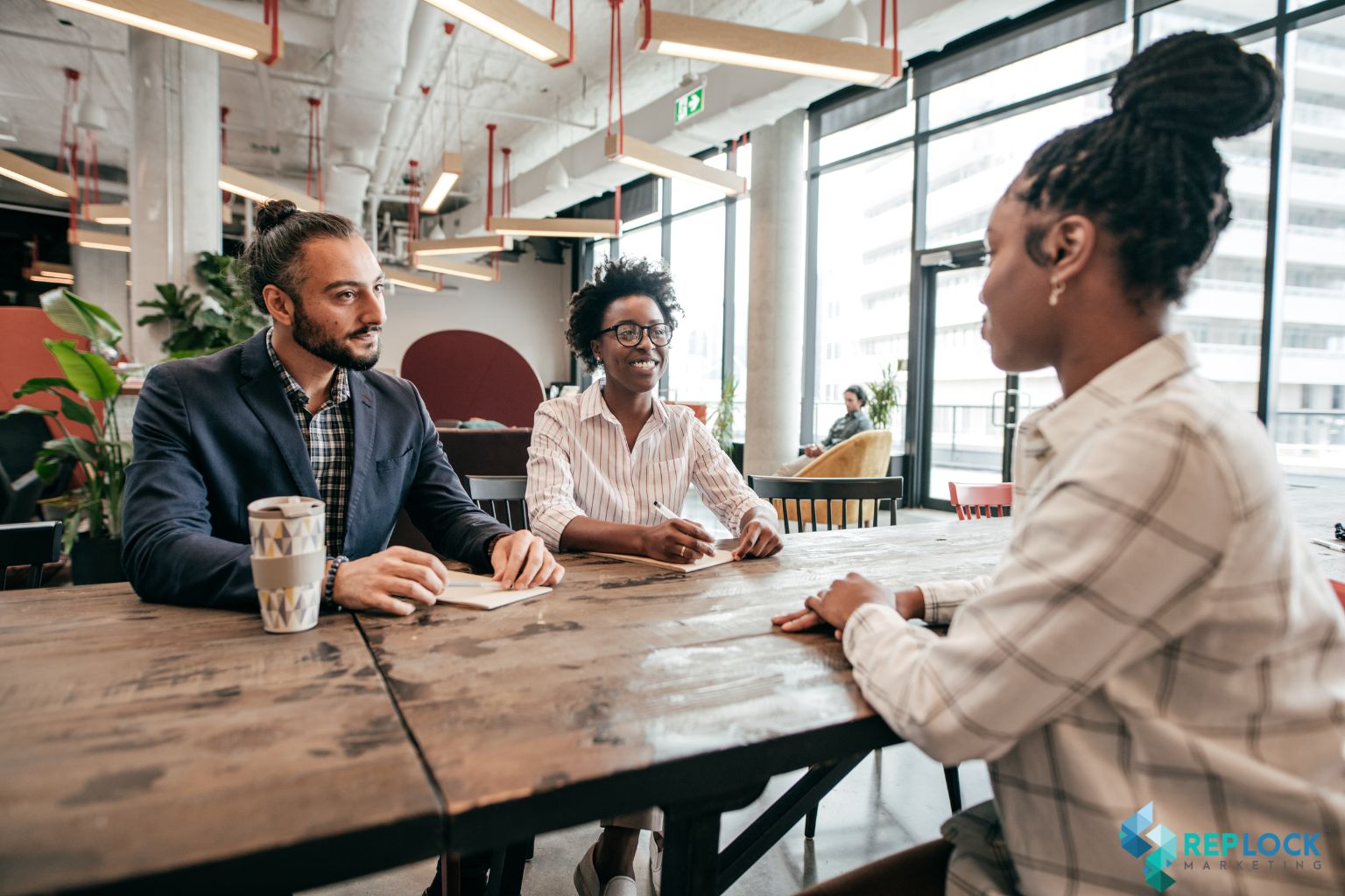 Three professionals discussing how to choose a marketing agency