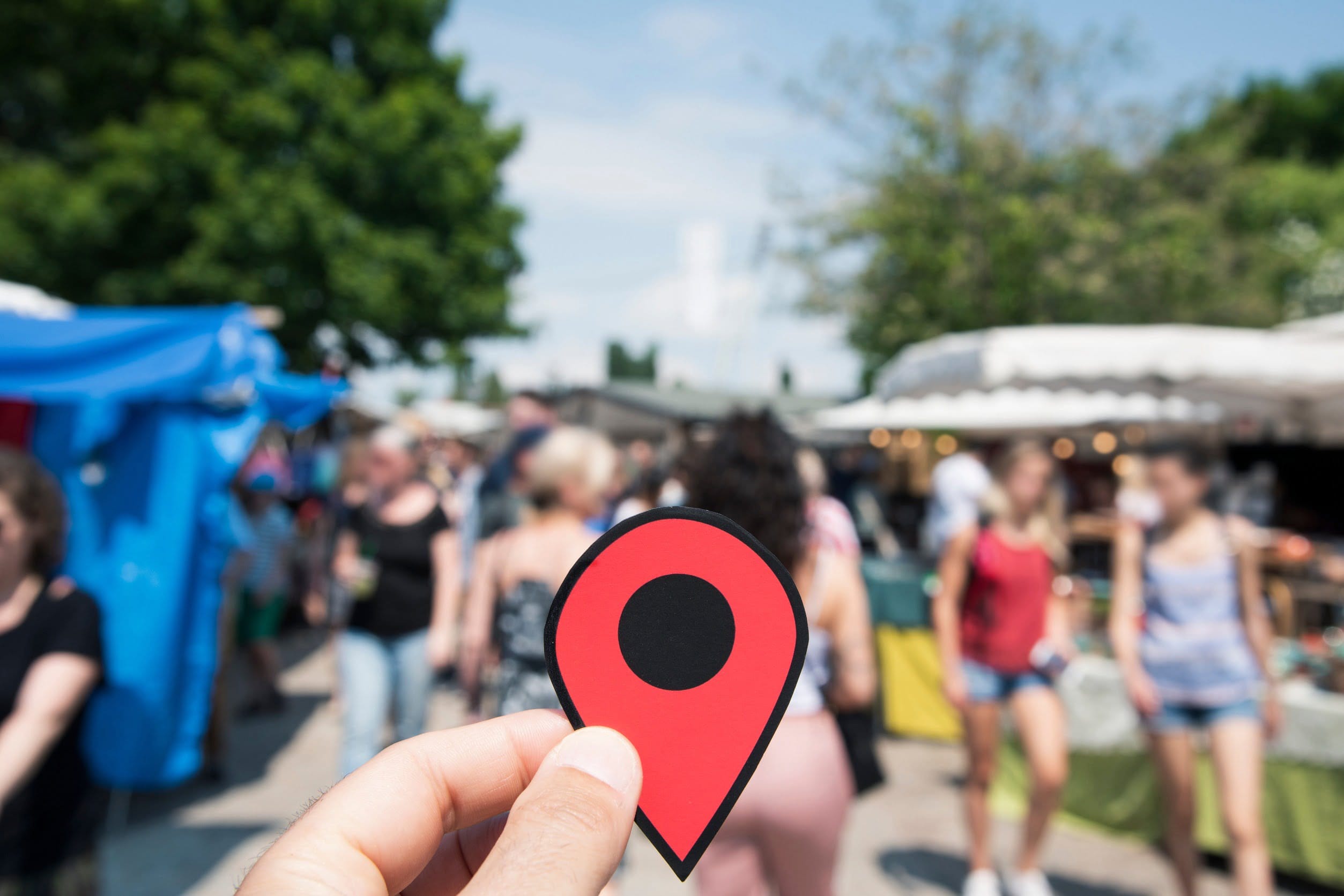 location marker in a crowd of people