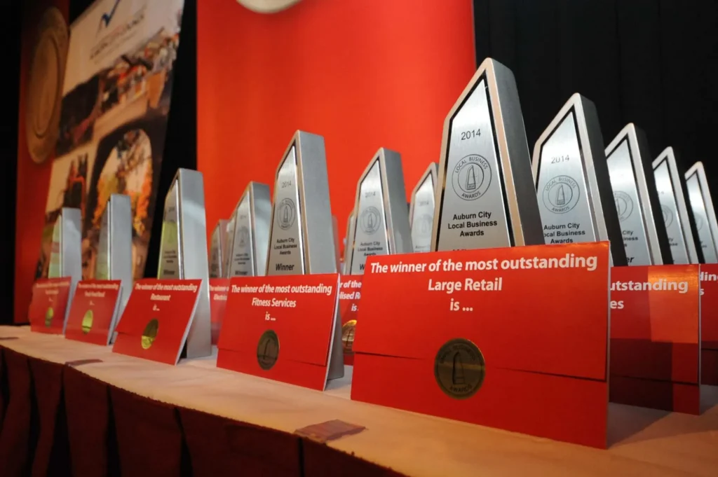 rows of awards for local businesses