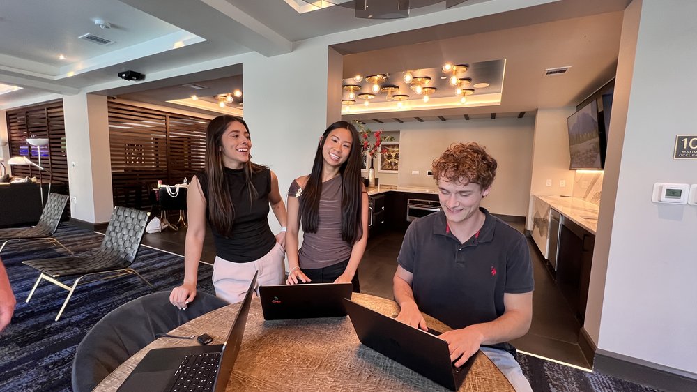 three people speaking about marketing