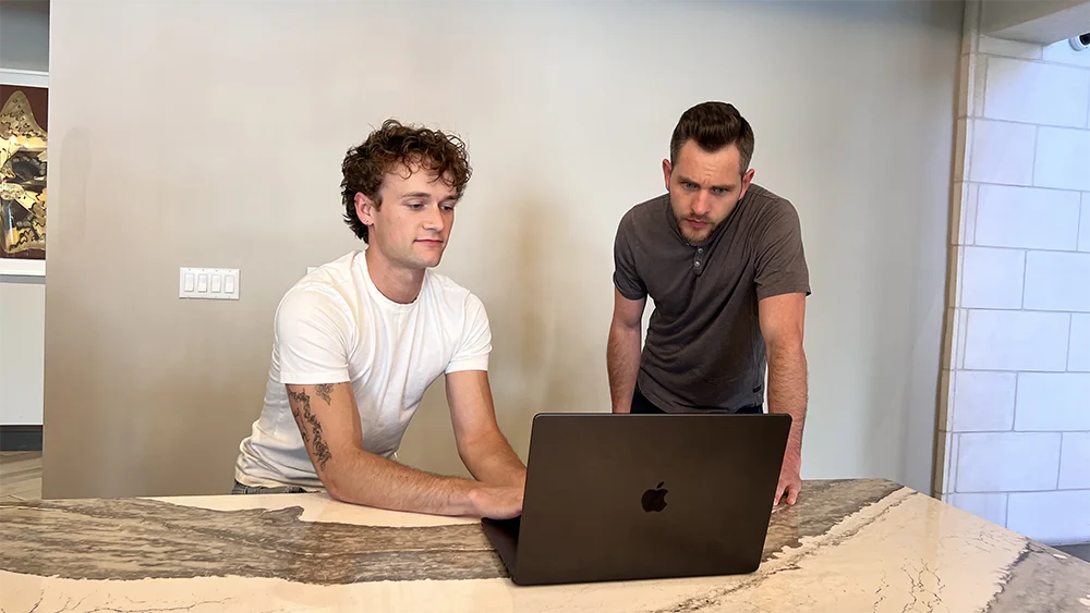 Trevor and Chris working on email marketing