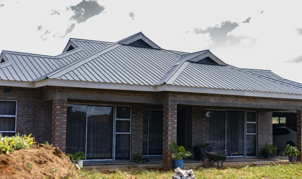 Brick house with a new grey metal roof