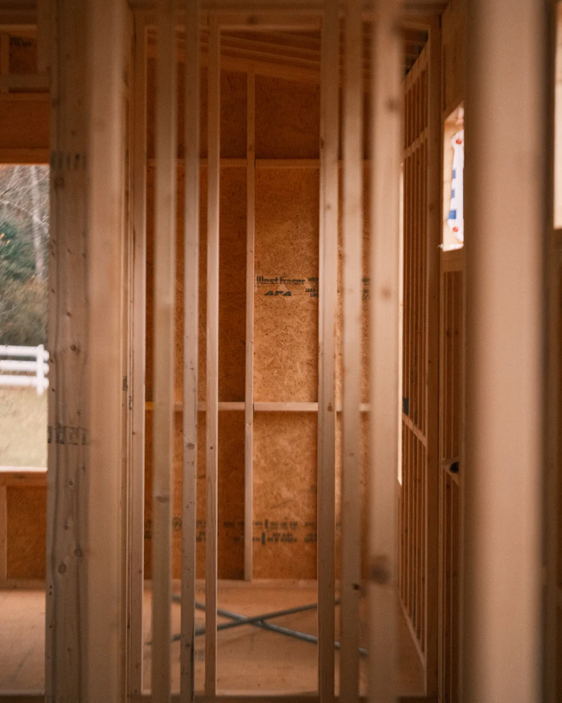 Exposed wood wall framing during a rebuild