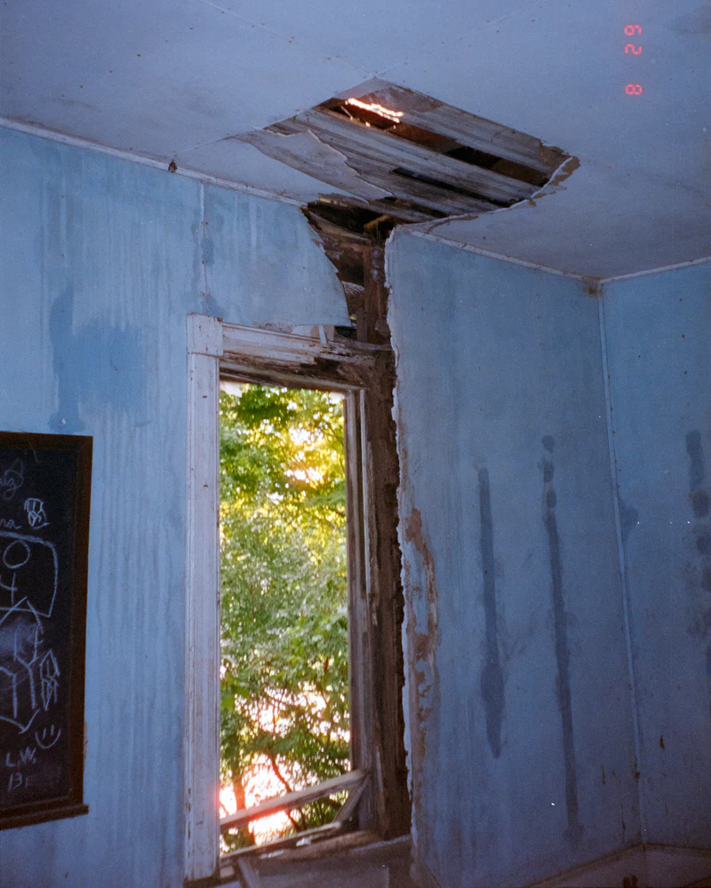 Room with a water-damaged wall and ceiling