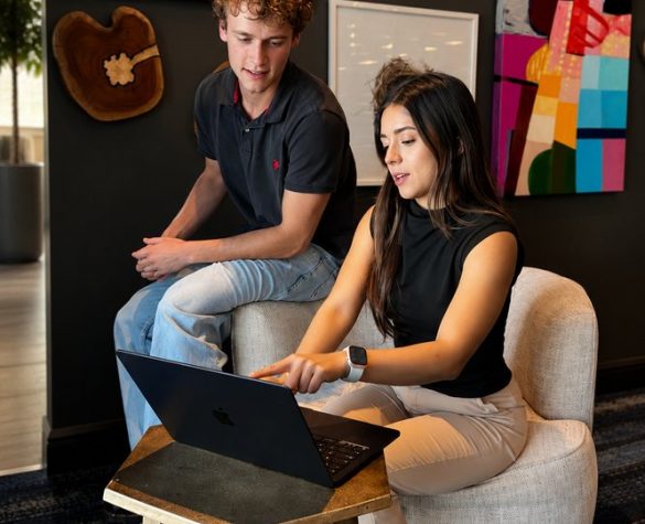 two people looking at computer