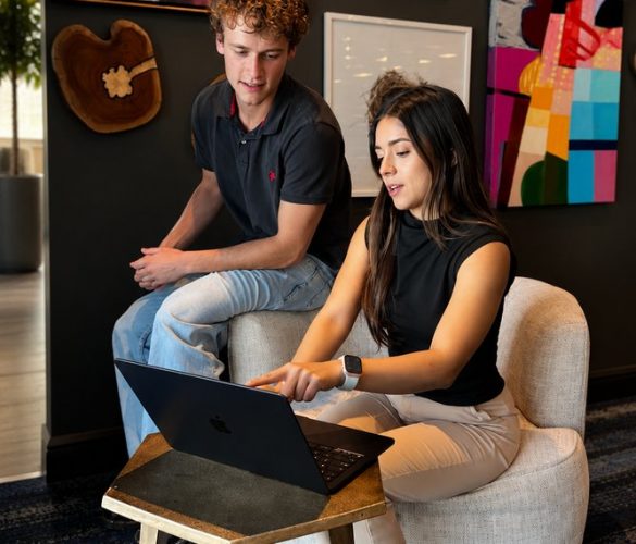two people looking at computer