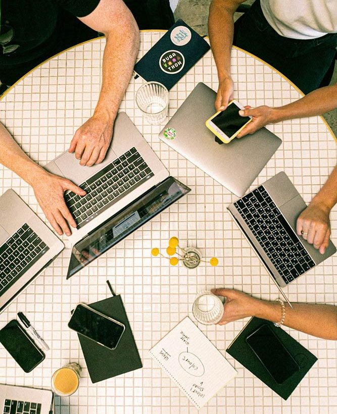 Digital Marketers working at table