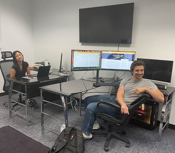 Jenna and Sam at desks