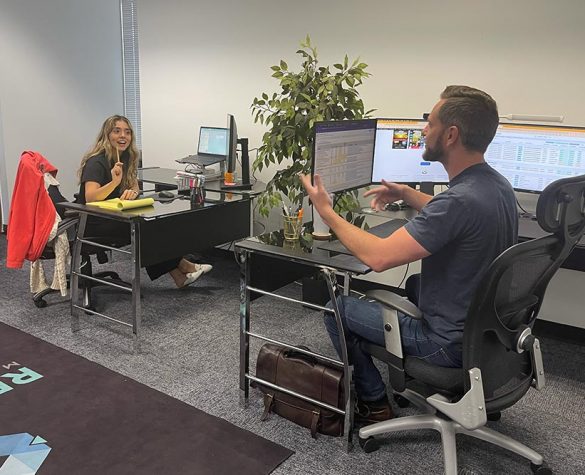 Mariela and Chris at desks