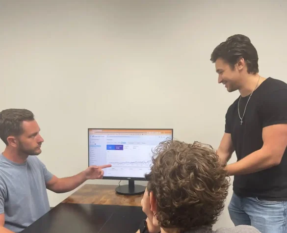 chris pointing at laptop