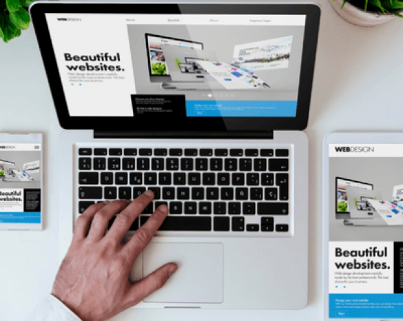 office tabletop with laptop and tablet showing beautiful designed website