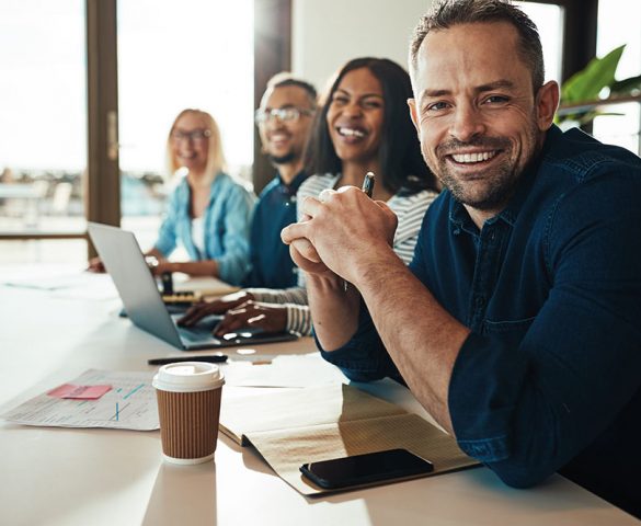 paid media employees working and smiling