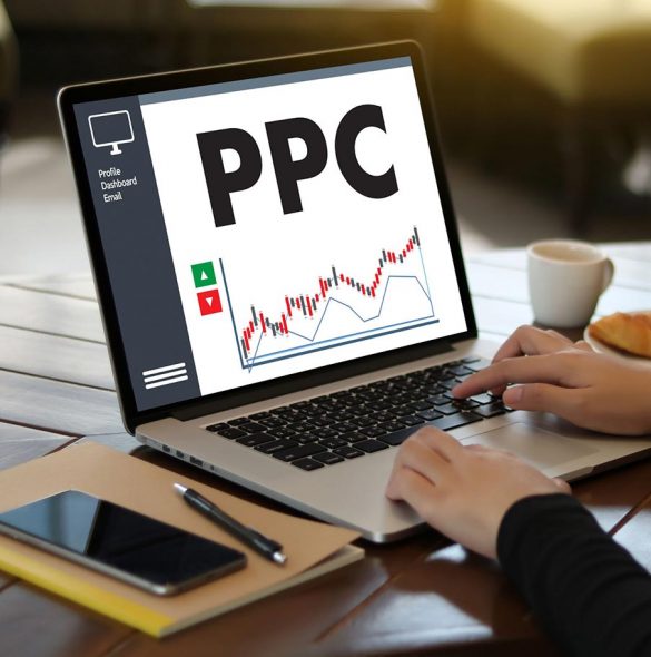 Woman on computer with ppc on screen